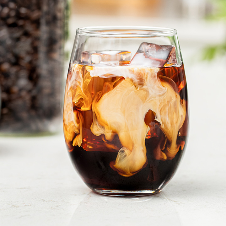 Glass of cold brew coffee with milk